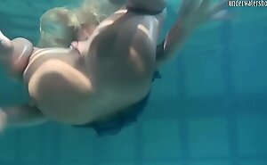Blonde Feher with big firm boobs underwater