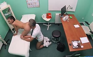Brown-eyed beauty acquires fingered and fucked by horny doctor