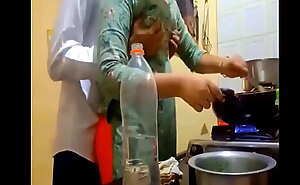 indian new married couple romance in kitchen