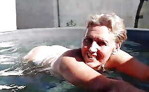 Bathing a cheerful slutty wife Lukerya near a mini pool naked under bright sunlight